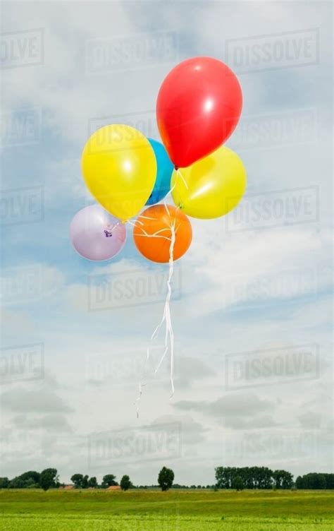 Balloons Floating In The Air Stock Photo Dissolve