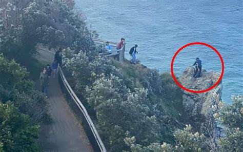 Photo Captures Shocking Moment People Scale Cliff To Take Selfie
