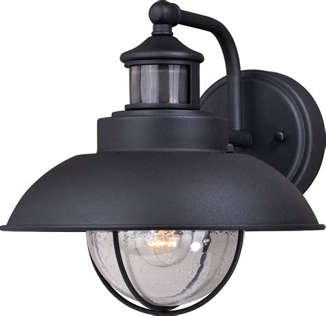 Led outdoor ceiling lights create a shaded light effect by balancing the light zones well with the shadow zones. Vaxcel T0262 Harwich Dualux Textured Black Outdoor Motion ...