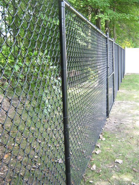 Insert another tension bar at the end of the fence where it meets the post using the same method as before. Chain Link | Sadler Fence and Staining LLC