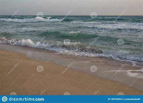 Waves Of The Blue Sea Splashing On The Sandy Shore Stock Image Image