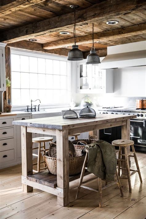 The builder says the island doubles as a laundry folding center and computer table. 44 Awesome Rustic Kitchen Island Design Ideas - PIMPHOMEE