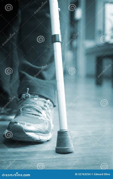 Man Walking On Crutches In Hospital Clinic Stock Photo Image Of Young