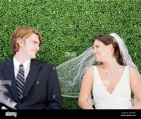 Bride And Groom Laying In Grass Stock Photo Alamy