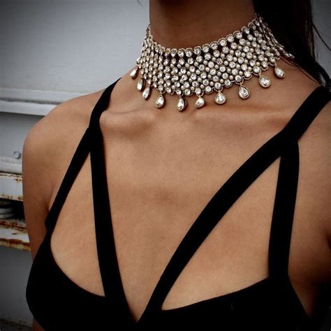 Diamond Choker That Covers Most Of Your Neck Paired With Hanging Crystal Pendants Pinned On