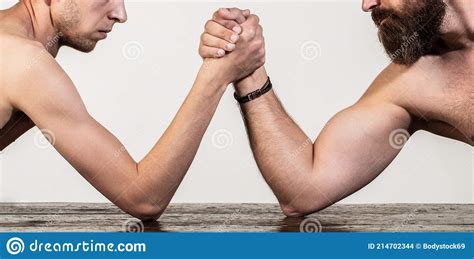 Two Manand X27s Hands Clasped Arm Wrestling Strong And Weak Unequal