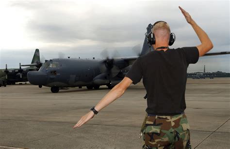 A Us Air Force Usaf Airman Marshals An Usaf Mc 130h Combat Talon Ii