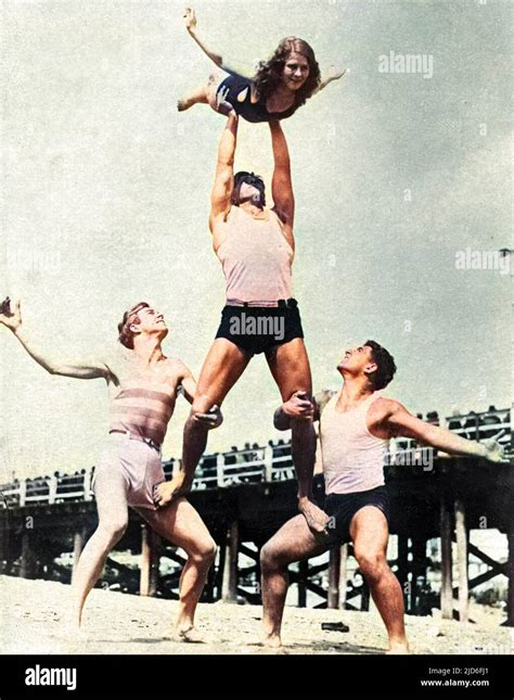 Three Men And A Girl Beach Acrobats Colourised Version Of 10167129 Date Early 1930s Stock