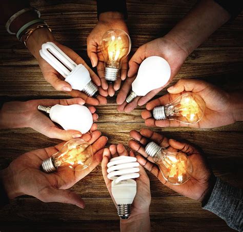 People Holding Light Bulbs In Their Premium Photo Rawpixel