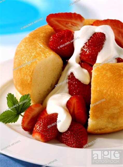 Strawberry Savarin With Lemon Syrup And Cream Stock Photo Picture And