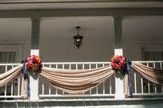More elaborate draping with columns in front of a fence Baby Wedding
