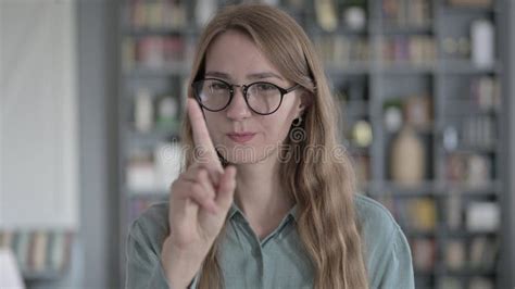 The Portrait Of Young Woman Saying No With Finger Sign Stock Image