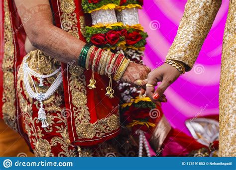 traditional indian wedding ceremony groom holding hand in bride hand stock image image of