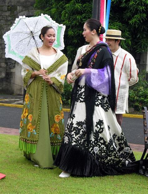 Women In Traditional Costume Strolling In Intramuros Walled City In