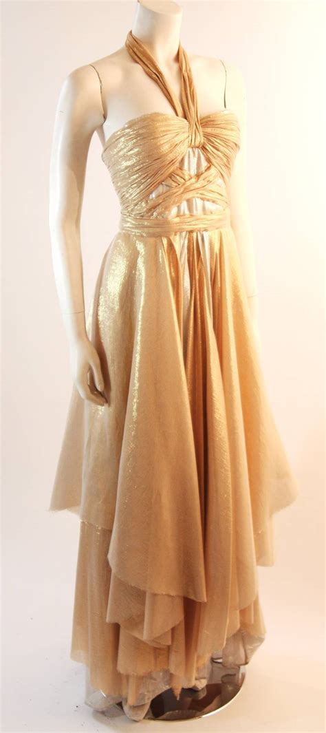 It is a favourite material in futuristic costumes and spacesuits for science fiction television and films. Elizabeth Mason Gold Lame Custom Couture Gown For Sale at 1stdibs