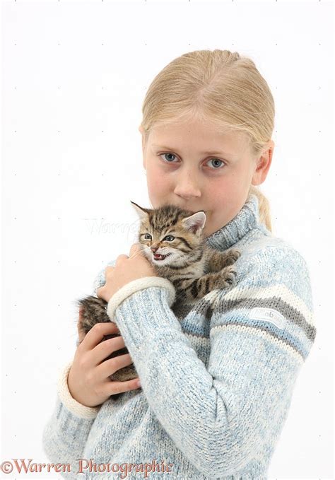 Girl Cuddling A Cute Tabby Kitten Photo Wp35705