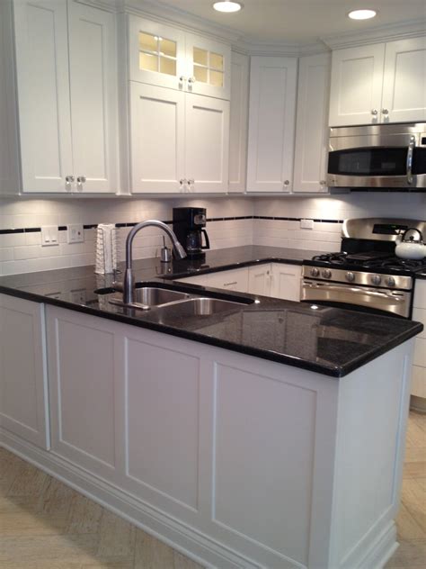 White cabinetry is a classic choice for a kitchen. Small U-shaped White, Custom, Painted Kitchen in Skokie ...