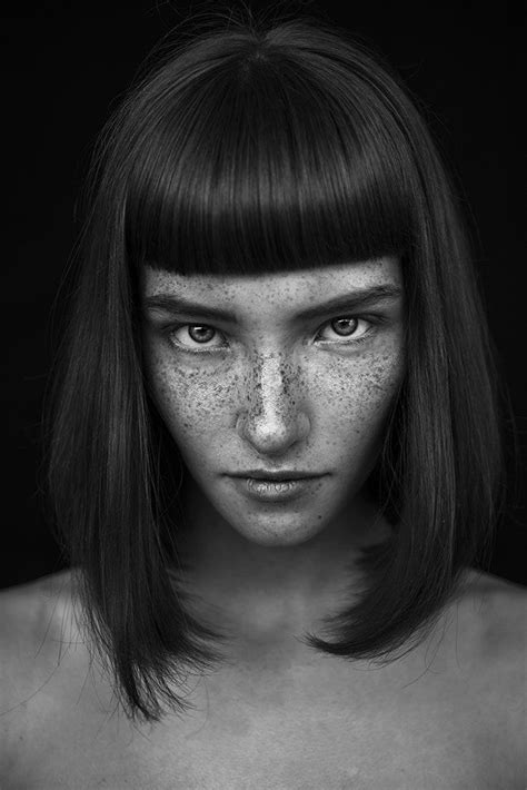 A Woman With Freckles On Her Face And Body Is Shown In Black And White