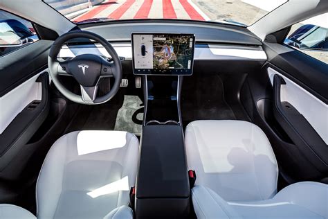 There are no physical controls, which can make sifting through the touch screen's menus risky while driving. Tesla Model 3 Review (2021) | Parkers