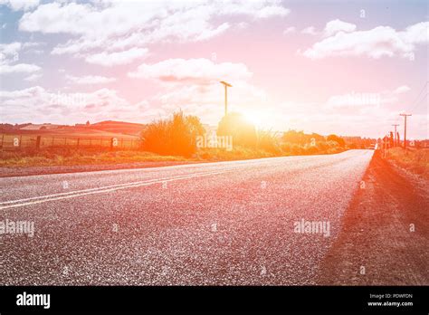 Picturesque Landscape Scene And Sunrise Above Road Stock Photo Alamy