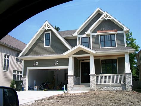 The choice to paint the picket fence steel blue, instead of traditional white, keeps the attention on the home's green door. Design: Amazing Colors From Behr Exterior Paint Colors For ...