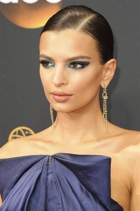 Emily Ratajkowski Oozes Glamour As She Hides Assets In Navy Gown At