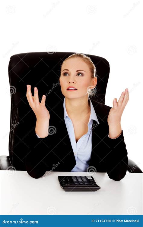 Nervous Business Woman Count On The Calculator Beahind The Desk Stock
