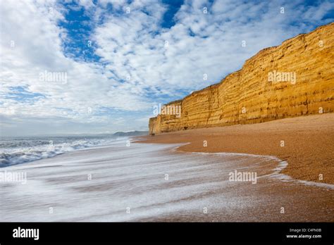 Waves Wash Clean Hive Beach Backed By Towering Sandstone Cliffs Burton