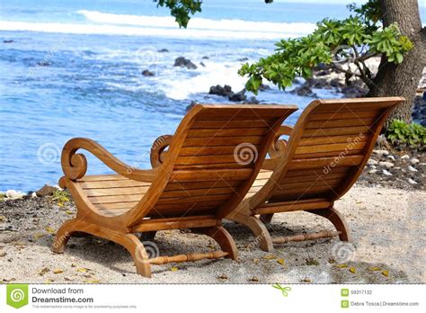 This versatile chair features a reclining option that allows you to adjust the angle of the chair back for supreme relaxation. Adirondack Chairs Beach Hawaii Stock Photo - Image of ...
