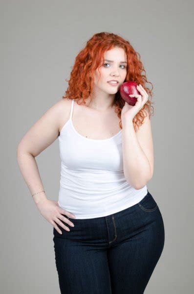 Beautiful Fat Girl With Red Hair With Burger In Hand On Gray Background