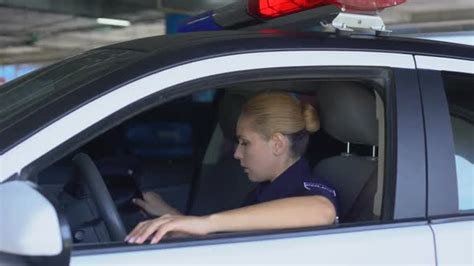 Exhausted Female Cop Officer In Police Car After Hard Work Day Stressful Job Stock Footage
