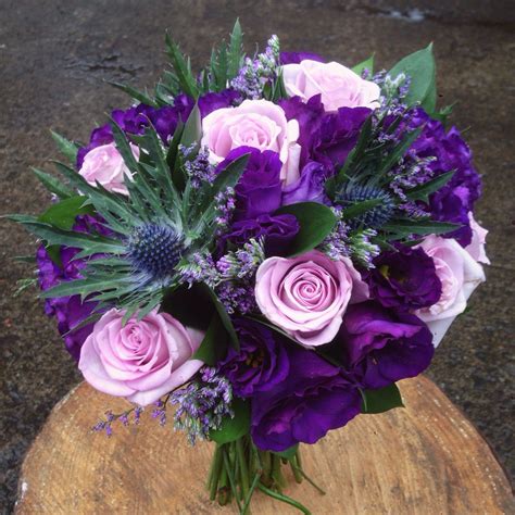 purple rose lisianthus and scottish thistle wedding bridal bouquet floreros centros de mesa