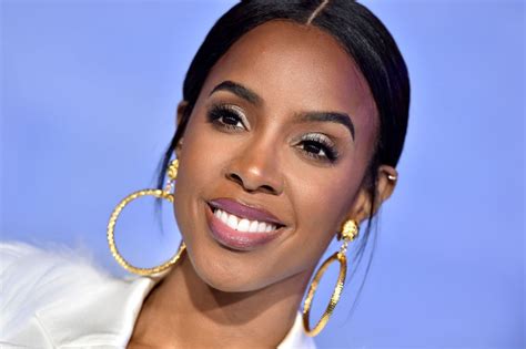Kelly Rowland Flaunts Ample Cleavage And Curves In Purple Tassel Jumpsuit In Stunning Photoshoot