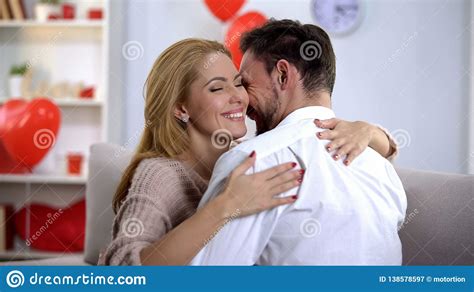 Passionate Husband And Wife Nuzzling And Hugging Spending Holiday Together Stock Image Image