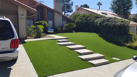 Gray stone pavers with grass or artificial grass. Pavers + Artificial Grass Design Ideas & Inspiration Gallery - INSTALL-IT-DIRECT