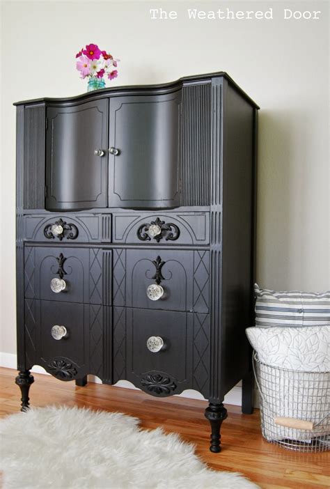 Make better use of your small space by inspecting the design and construction of the dresser drawers. A tall black dresser with glass knobs - The Weathered Door