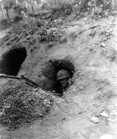1944 wwii us soldier seeks cover in foxhole saint lô normandy france 23 july 1944 a military
