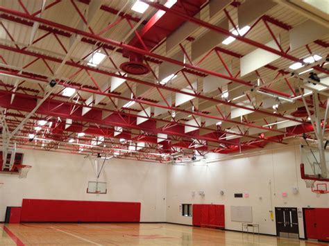 Suspended ceiling panels absorb sound and are made mostly of recycled content. Suspended acoustic panels in a gymnasium ceiling. Panels ...