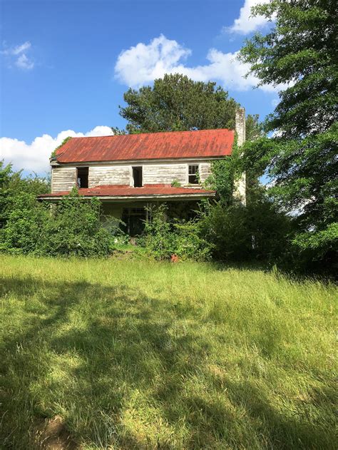 Abandoned Federal Farmhouse On A Spring Afternoon Eastern North