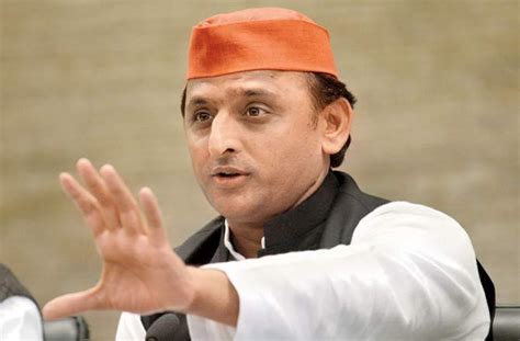 A laptop displaying up cm akhilesh yadav's image on desktop. 'Will hold talks with BSP, Congress made us wait for long ...