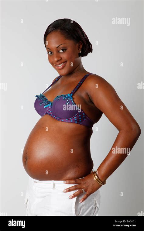 Pretty Black Girl Heavily Pregnant Showing Off Her Belly Stock Photo Alamy