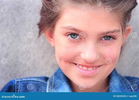 Tween Girl Relaxing On Couch At Home Royalty Free Stock Photo