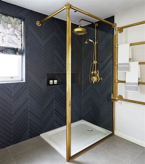 Bathroom With Black Herringbone Tiles On Wall Via Drummondsbathrooms