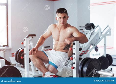 Portrait Of A Handsome Man Doing Exercises In The Gym Stock Image