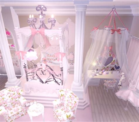 A Bedroom Decorated In Pink And White With Lots Of Furniture