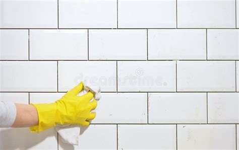Finishing The Tiling Of The Kitchen With White Tiles Stock Photo