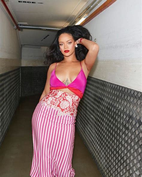 Rihanna Flaunts Her Cleavage As She Puts On Sexy Display In A Slinky