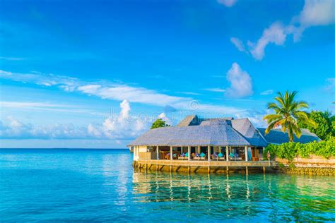 Beautiful Water Villas In Tropical Maldives Island At The Sunrise Time