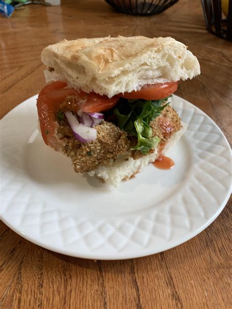 Buffalo Chicken Nugget Sandwich With Tomato Red Onion And Kale R