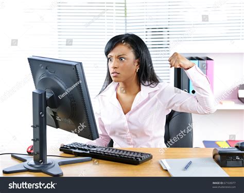 Angry Young Black Business Woman Punching Computer In